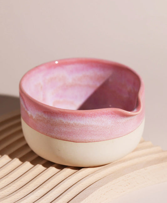 Handcrafted katakuchi matcha bowl with a spout, featuring a delicate pink glaze